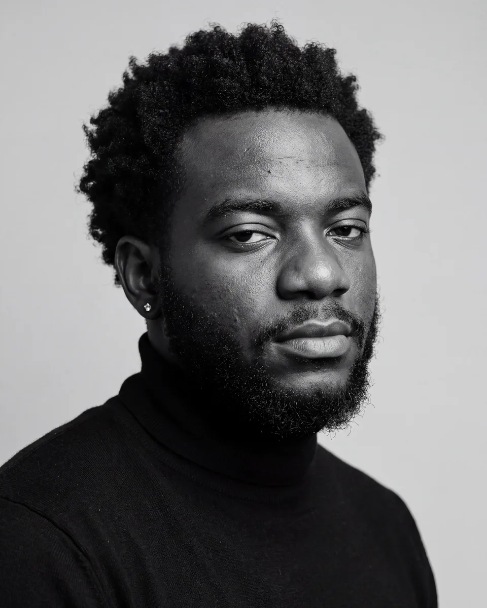 Oluwasegun Elijah Ajanaku, seated studio portrait
